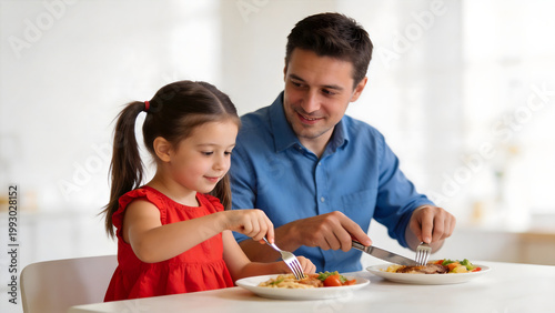 Man and girl eating dinner together