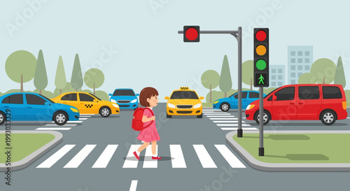 Child crossing street at crosswalk with traffic lights and cars