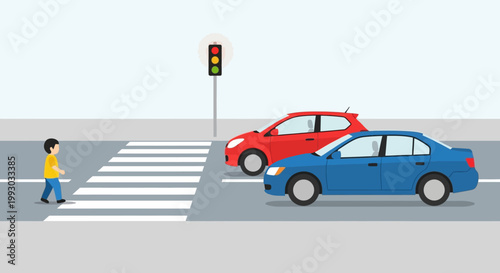 Child crossing street safely at crosswalk with cars stopped at traffic light