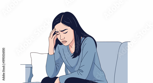 Frustrated woman with hand on forehead, sitting on sofa, looking down