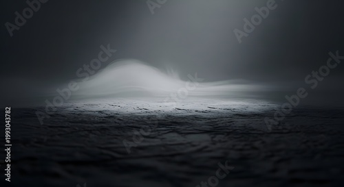 Dramatic storm clouds loom over a landscape of crashing ocean waves and rocky Icelandic shores as a powerful wind sweeps across the dark nature of the stormy coast