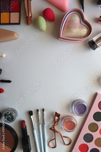 Various colorful cosmetic products on white background. Flat lay.