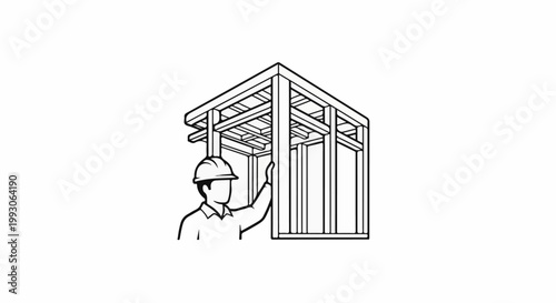 Construction worker inspecting a framed building structure