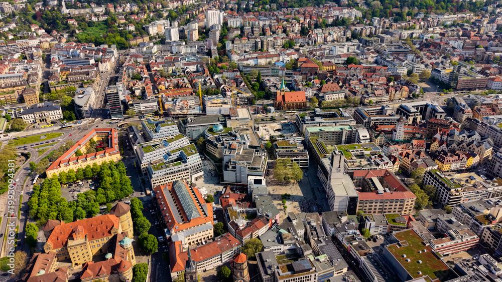 Obraz premium A panoramic aerial view above the old town and downtown in the Stuttgart the capitol city of Baden-Württemberg in Germany on a sunny spring day