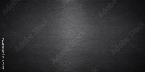 A dark black leather texture with a rough grunge pattern creates a vintage grey material surface for a blank charcoal canvas backdrop or textured wallpaper design