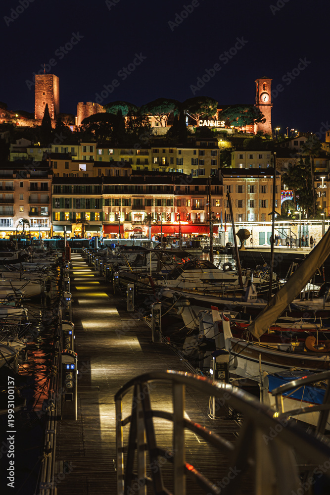 Fototapeta premium Illuminated Cannes old town and marina at night