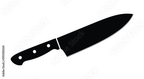 A sharp chef s knife is displayed in a striking black silhouette
