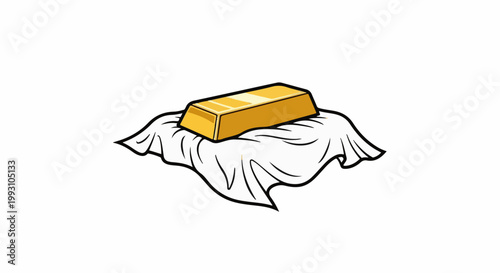 A bright yellow gold bar rests on a draped white cloth