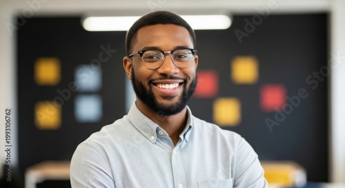 Professional business man smiling in a modern corporate office environment for a successful digital marketing career lifestyle concept with bright natural lighting