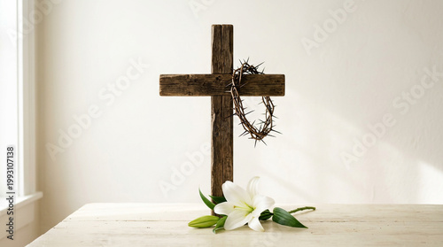 Rustic wooden cross with crown of thorns and white lily flower on a bright background representing Easter and resurrection