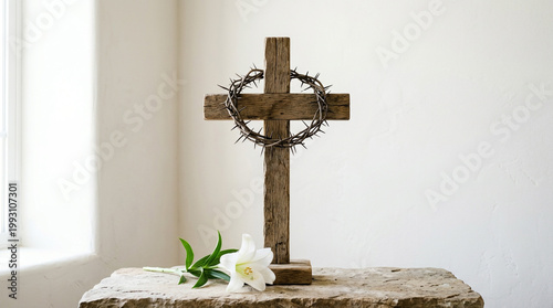 Christian wooden cross with crown of thorns and white lily on stone surface, symbolizing the resurrection of Jesus Christ for Easter