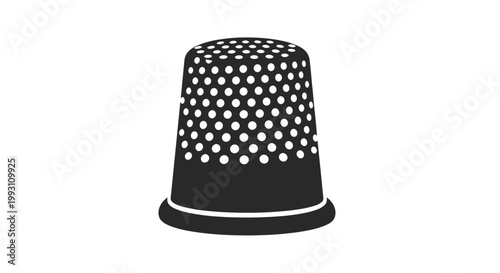 Foto Black thimble with white dots closeup.