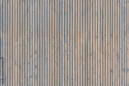 Wainscoting seamless texture made of thin gray-toned pine timber planks provides textured backdrop for design