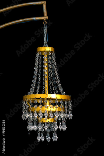 Elegant chandelier with golden frame and crystal droplets