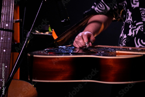Guitar playing on stage live concert instrument detail