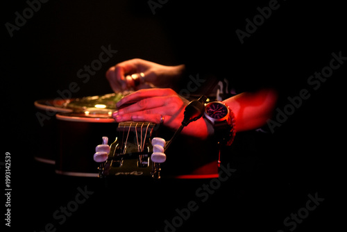 Guitar playing on stage live concert instrument detail