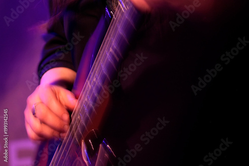 Guitar playing on stage live concert instrument detail