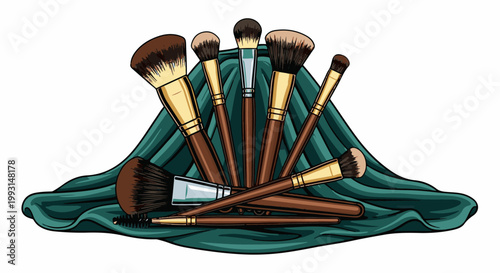Assortment of makeup brushes arranged on draped teal fabric