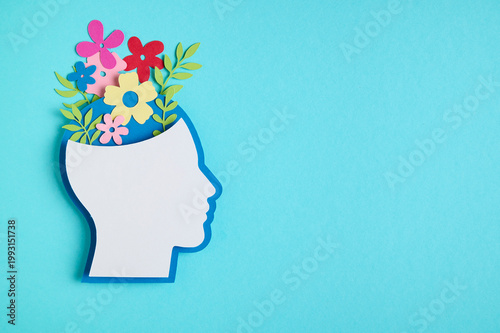 Photos Mental health concept featuring a head silhouette and a flowers blooming