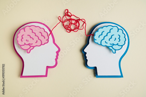 Mental health concept featuring the heads and brains of a man and a woman