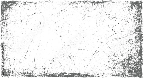 Grungy distressed texture with scratches and speckles on a white background grunge