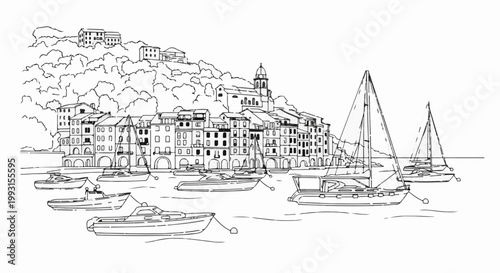 Coastal town with sailboats and motorboats docked in the harbor