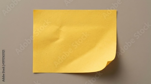 Blank yellow sticky note with a curled corner and generous copy space, crisp paper texture, simple clean stationery styling, ultra-realistic, no logos.