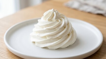 Close up of fluffy white whipped cream swirled beautifully on a surface, soft airy dessert texture in a clean minimal food composition, bright studio light, no logos