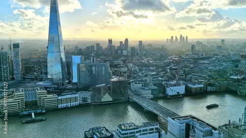 London aerial panorama at sunset. View include river Thames, London bridge, skyscrapers and beautiful sky. 
