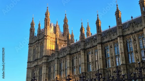London, UK Houses of Parliament historical buildings at sunset.