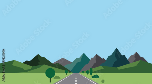 Empty asphalt road leading through a beautiful mountain landscape under a clear sky.