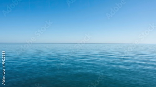 Calm ocean water with clear blue sky.