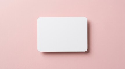 White blank rounded rectangle on a soft pink background with a subtle shadow, clean minimal display template for product presentation or label design, studio lighting, crisp detail, no logos