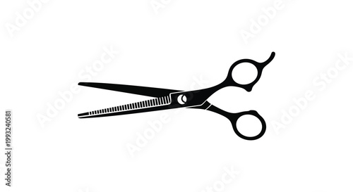 A black silhouette of professional hair cutting scissors sharply defined silhouette