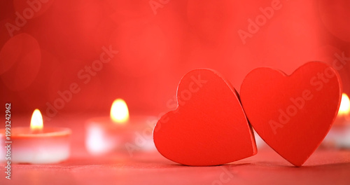 Картината върху платно Hearts and candles create romantic setting for celebration or special occasion i