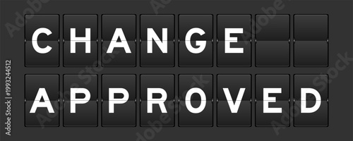 Black color analog flip board with word change approved on gray background