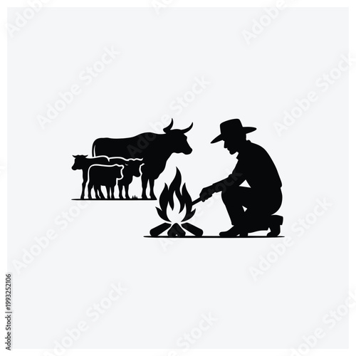 Silhouette of a herder beside a campfire with cattle and sheep