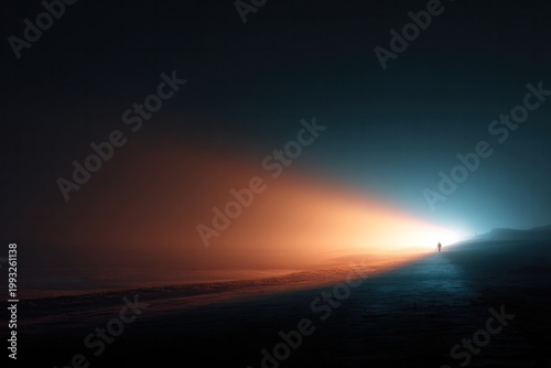 Solitary figure walking toward sunset on misty beach