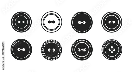 Collection of various black and white buttons.