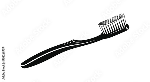 A black and white image of a toothbrush displaying a striking silhouette