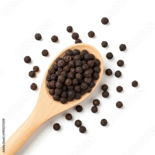 Spilled Black Peppercorns with Wooden Spoon