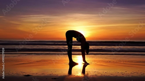 Silhouette of Woman Practicing Yoga on Beach at Sunset