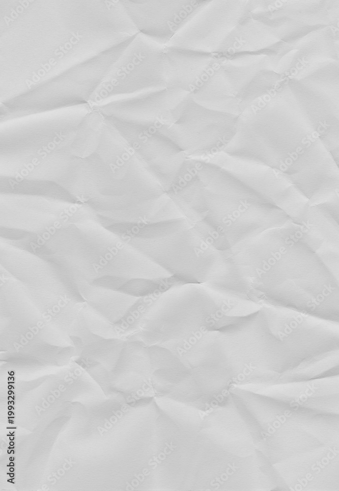 Fototapeta premium Textured Paper's Whispers: Close-up of crumpled paper, revealing an intricate tapestry of folds and shadows, ideal for conveying depth, texture, and abstract design.