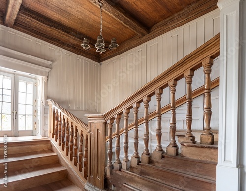 an antique wooden staircase with a detailed banister and white paneled walls with a wood ceiling and beam