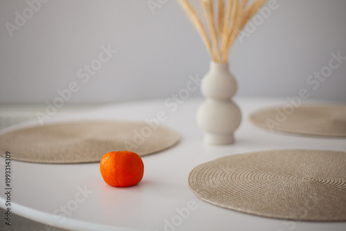 Beautiful tangerine on a stylish white table