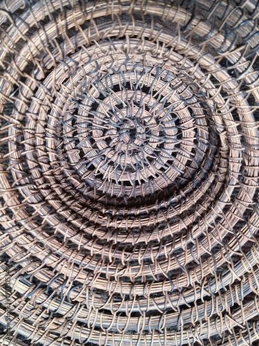 Abstract circular pattern of natural straw weaving