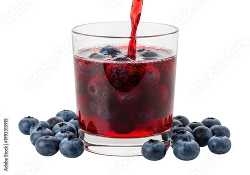 Freshly poured blueberry juice with a whole berry in the glass