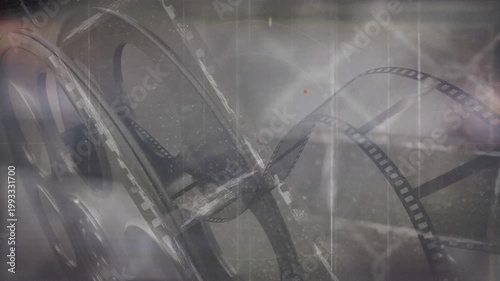 On play film reels and strips unspooling, shifting scratches flaring then settling to evoke archive