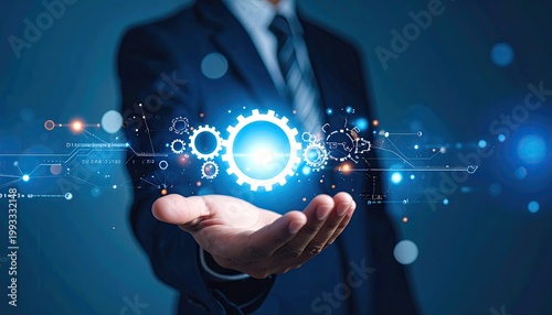 Man in a suit presents a glowing gear with digital lines and light effects