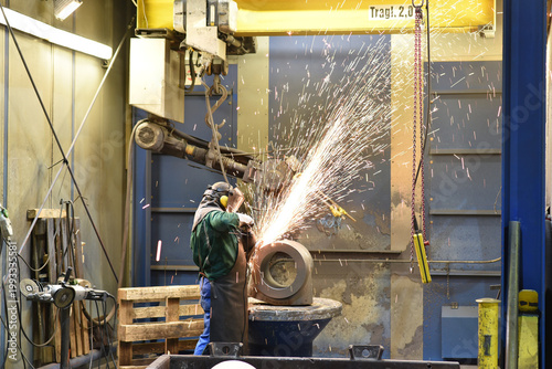 workers in an industrial plant - workplace foundry - production of steel castings